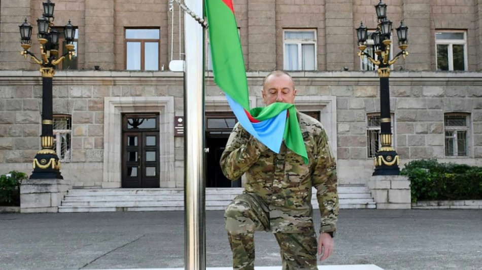 Azerbaijan leader raises national flag in Karabakh capital 