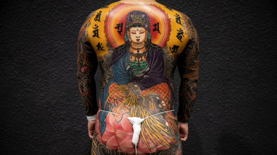 Des maîtres du tatouage exhibent leur savoir-faire dans une foire à Hong Kong