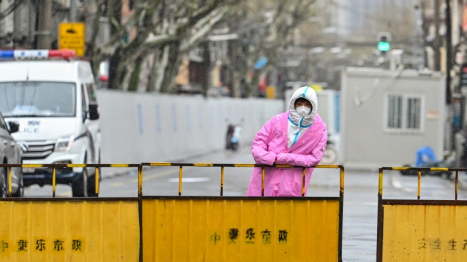 Shanghai warns against 'panic' as Covid cases mount