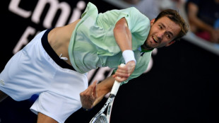Medvedev gets crowd onside to reach last 16 for fourth year